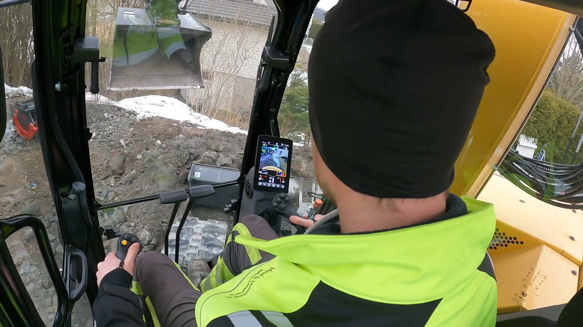 Inside a powerful excavator cab with skilled heavy equipment operator