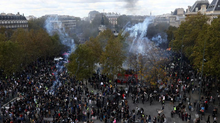 General view of the Place de la Republique as protesters walk through tear gas during a demonstration at the Place de la Republique in Paris on Saturday, October 17, 2026. - Jack Taylor/Reuters