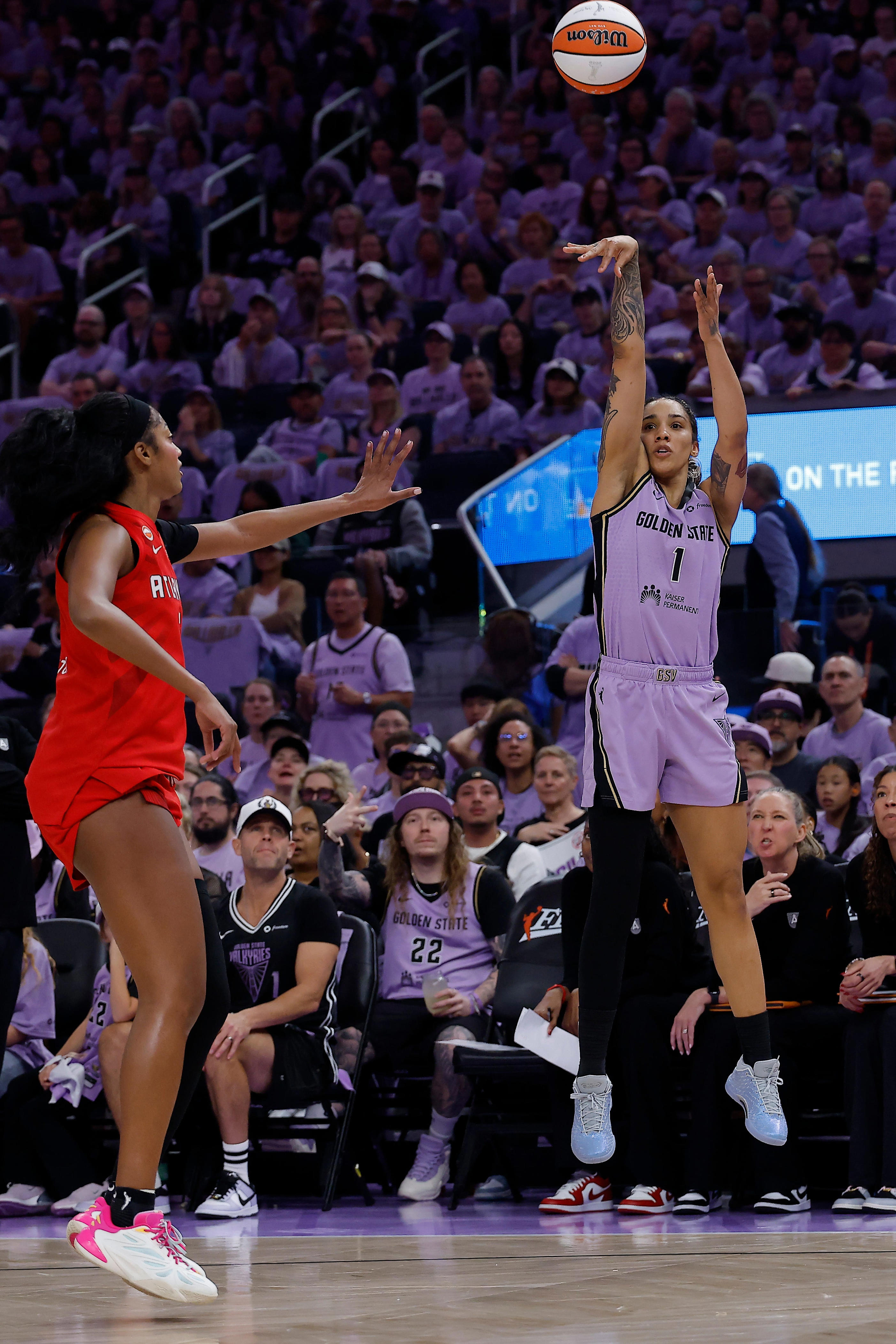 Golden State Valkyries forward Gabby Williams (1) shoots the ball against Atlanta Dream forward Angel Reese (5) during the second quarter of game one of the 2026 WNBA Finals at Chase Center.
