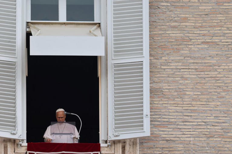 Pope Leo appears at a window of the Apostolic Palace, in his first public event since cancer surgery, at the Vatican, October 18, 2026. REUTERS/Yara Nardi