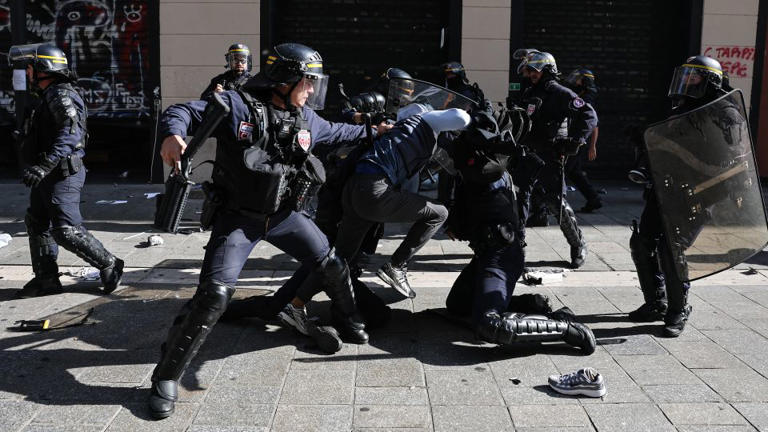 French police detain a protester during clashes prior to the start of a demonstration in Marseille, southern France, on Saturday, October 17, 2026. - Thibaud Moritz/AFP/Getty Images
