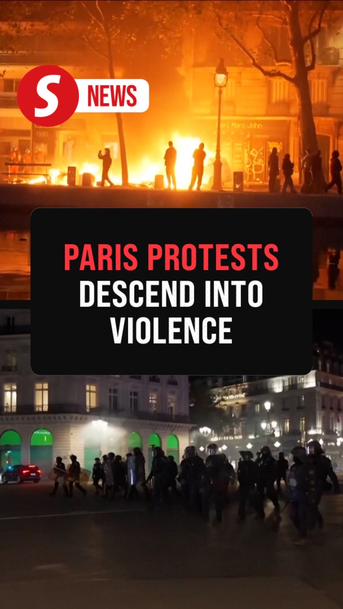 Cars on fire, shattered glass: protests turn violent in Paris