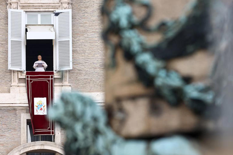 Pope Leo appears in a window of the Apostolic Palace over St. Peter's Square in his first public event since his cancer surgery, at the Vatican, October 18, 2026. REUTERS/Stoyan Nenov