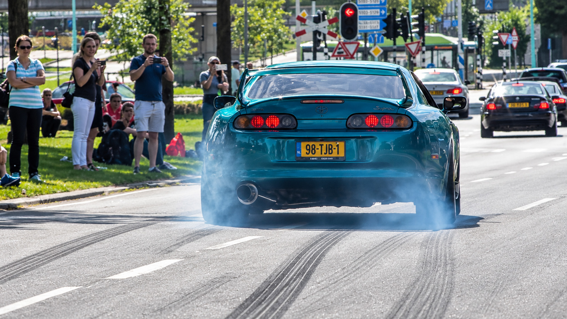 Toyota Supra breaks traction during launch near the crowd