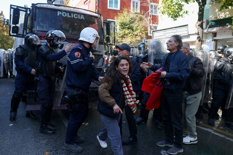Police officers are confronted by protesters, during an anti-government protest by students in Tirana, Albania, October 18, 2026. REUTERS/Louisa Gouliamaki