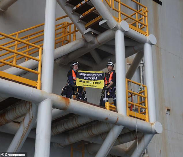Two protesters in custody after Greenpeace stunt on gas rig off the ...