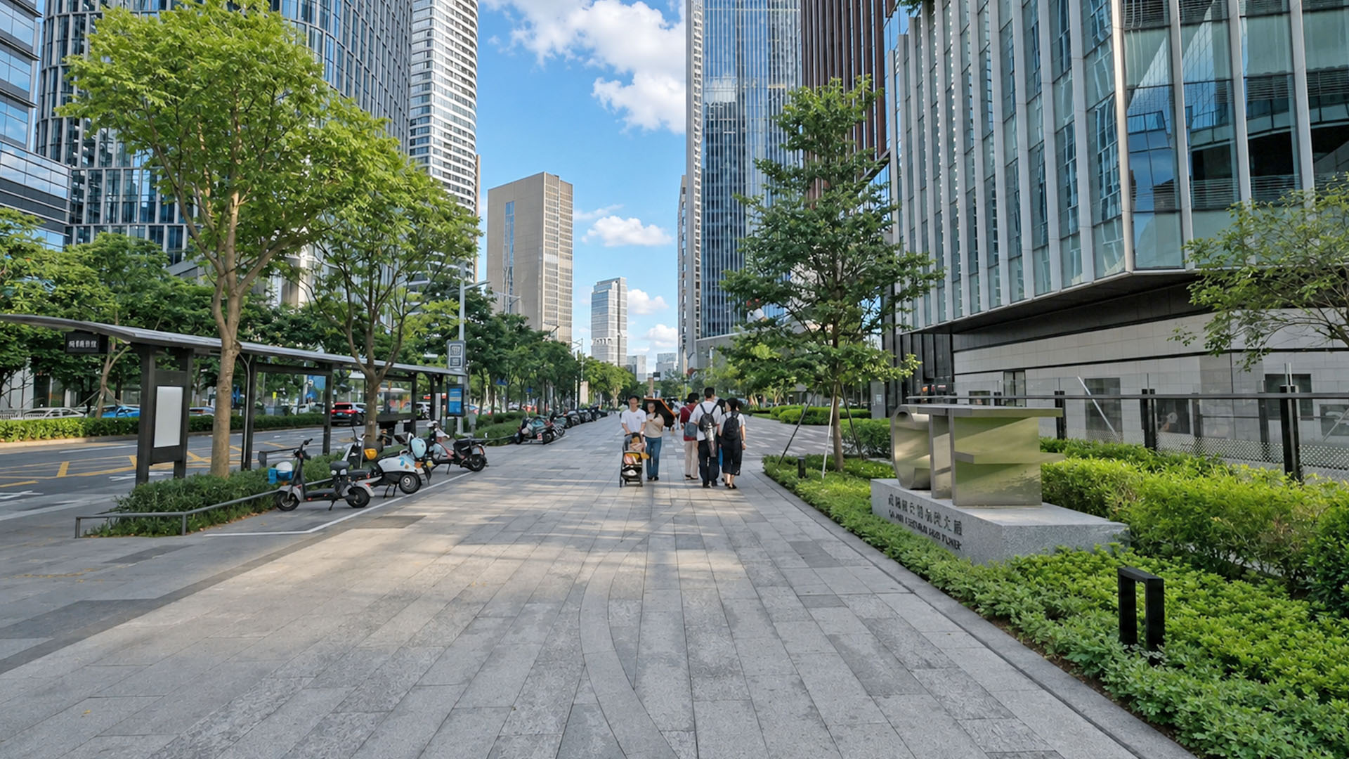 China’s glass towers rise above a calm urban walkway