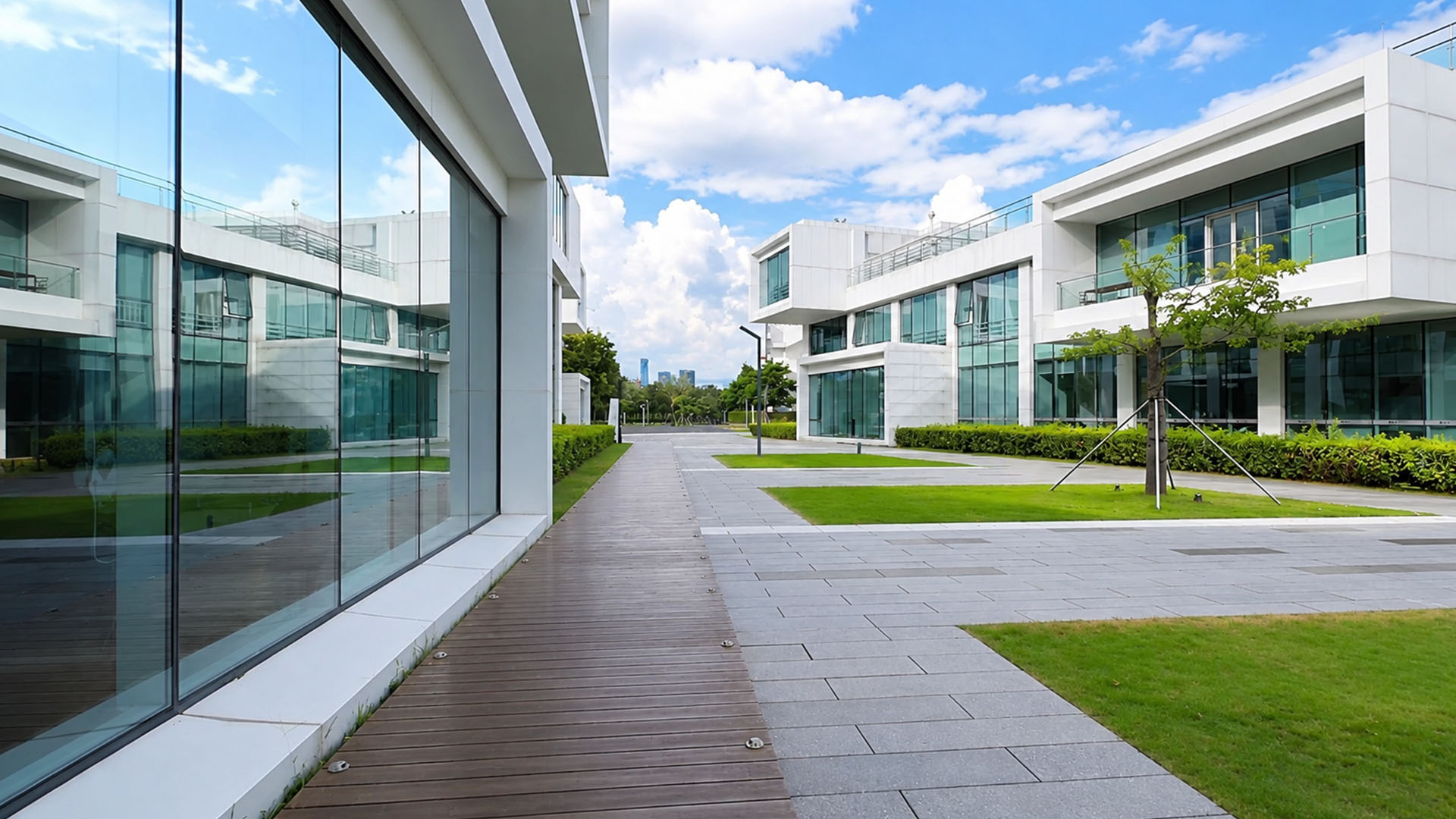 Modern white buildings line this peaceful Shenzhen walkway
