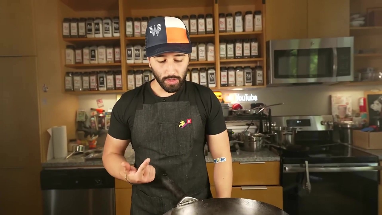 A cook shows how to clean a wok