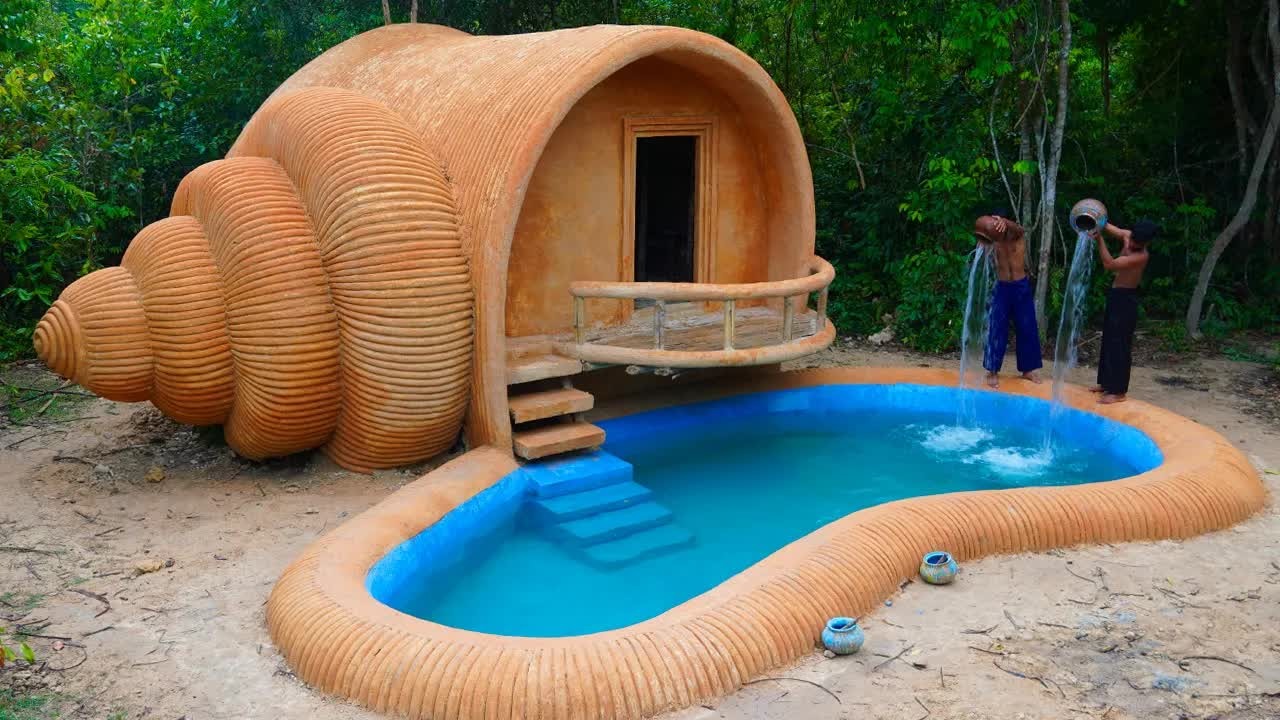 Jungle builders make a shell-shaped house with a swimming pool
