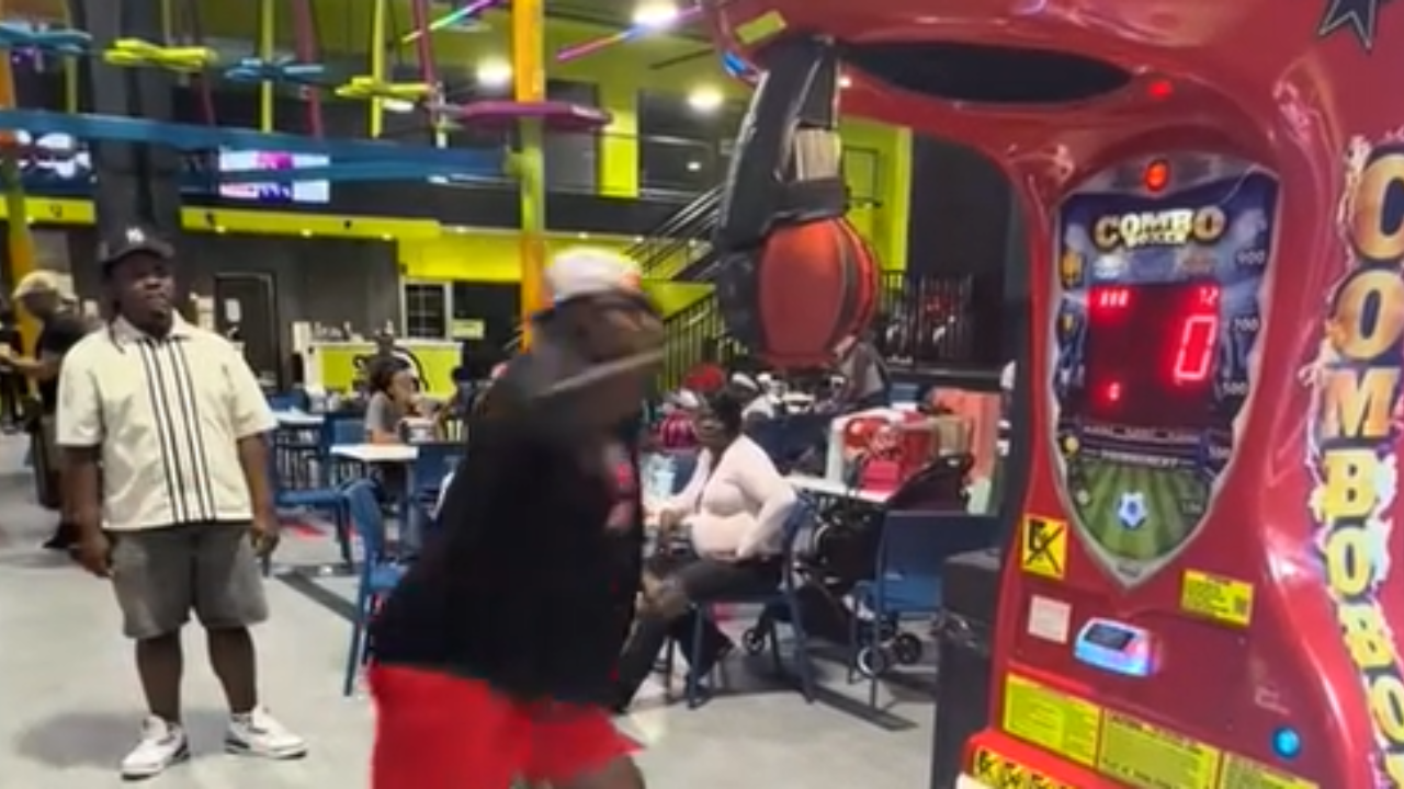 Man hits arcade machine with big punch and wipes out