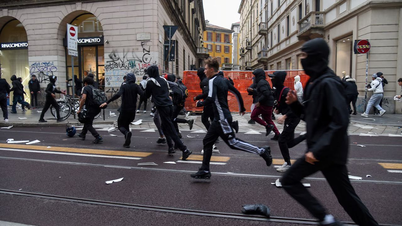 Protests in Italy echo France as shops looted and bins set on fire in Milan