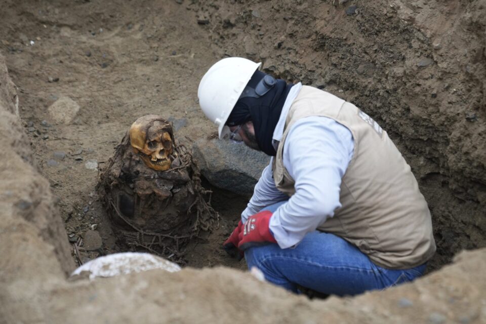 Workers digging a trench for a gas pipe under a street in Lima found a ...