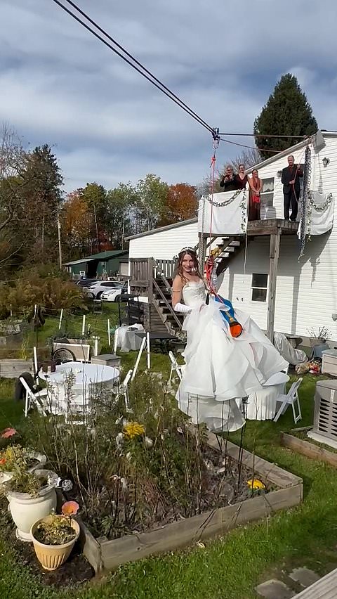 Bride honors late father with zipline entrance at wedding