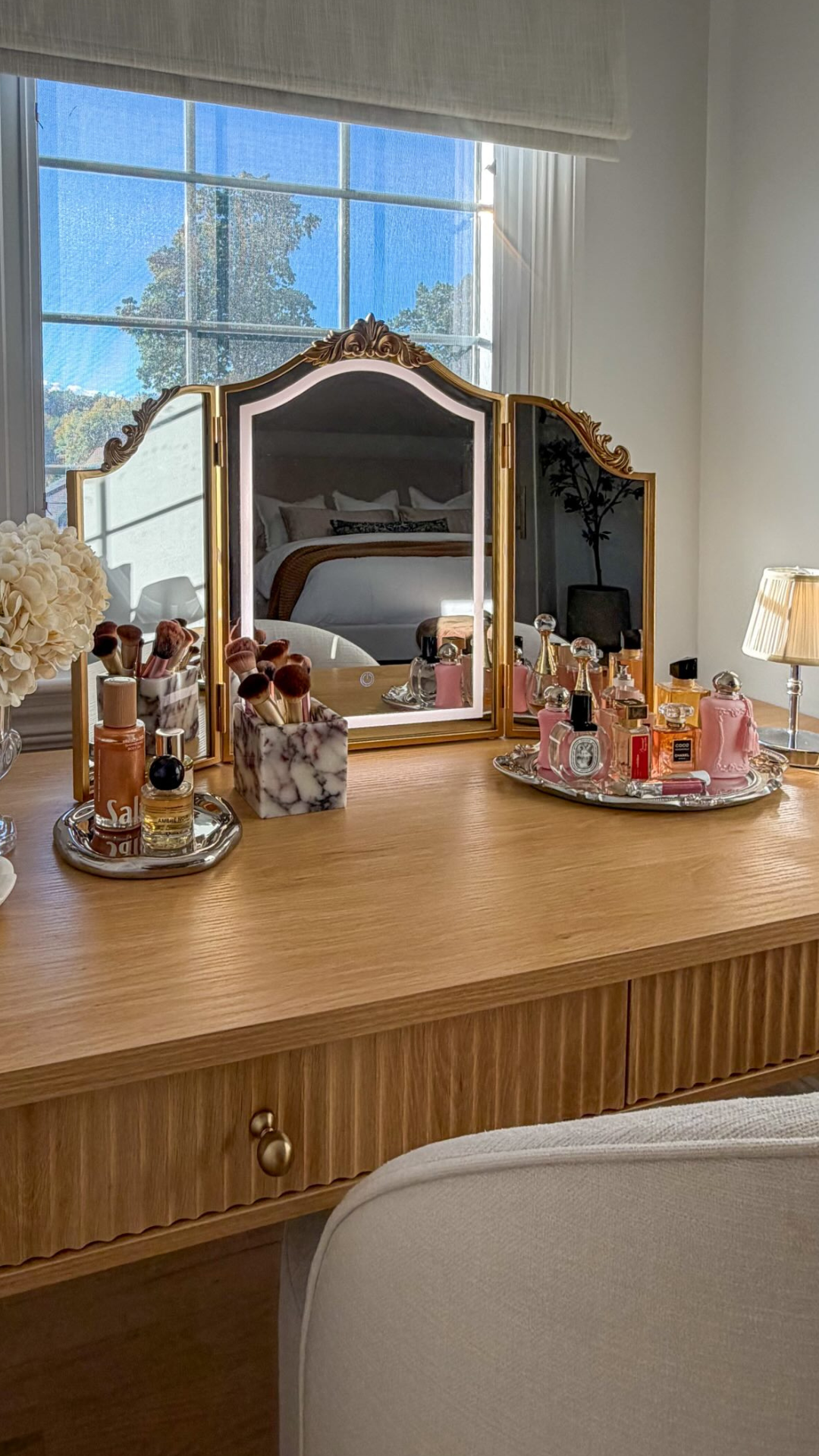 How a fluted desk and gold mirror transform a vanity corner