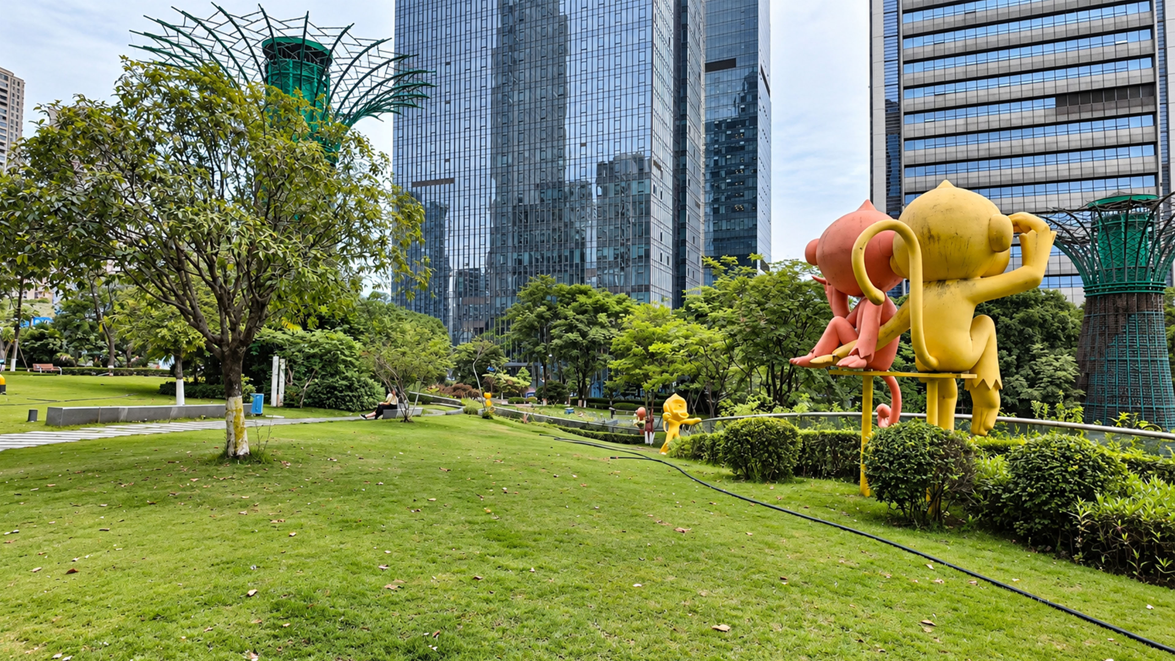 Giant cartoon sculptures stand beneath China’s glass towers