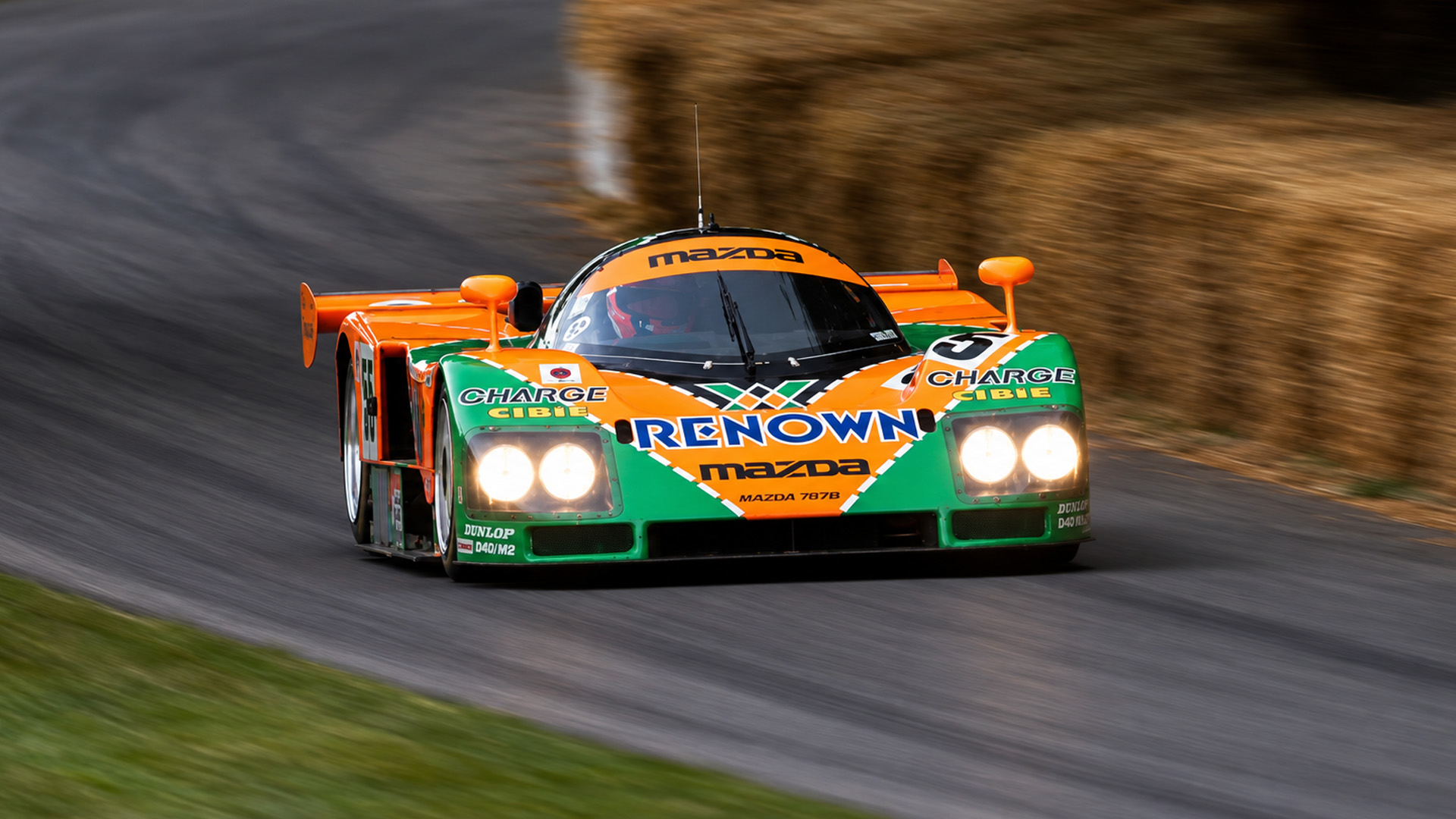 The legendary Mazda 787B blasts past with a piercing rotary scream