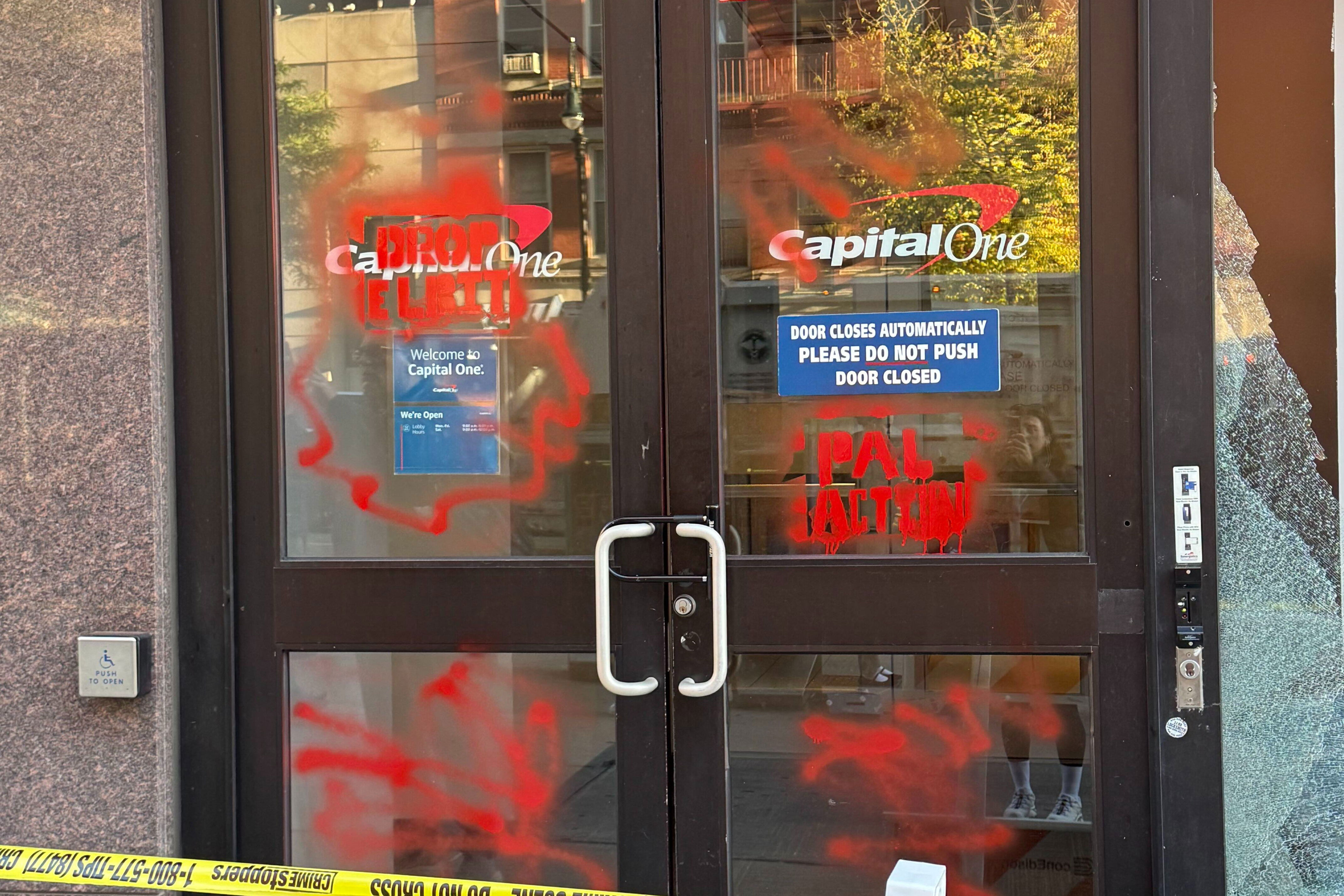 Window of NYC bank smashed, facade marred with red graffiti in possible ...