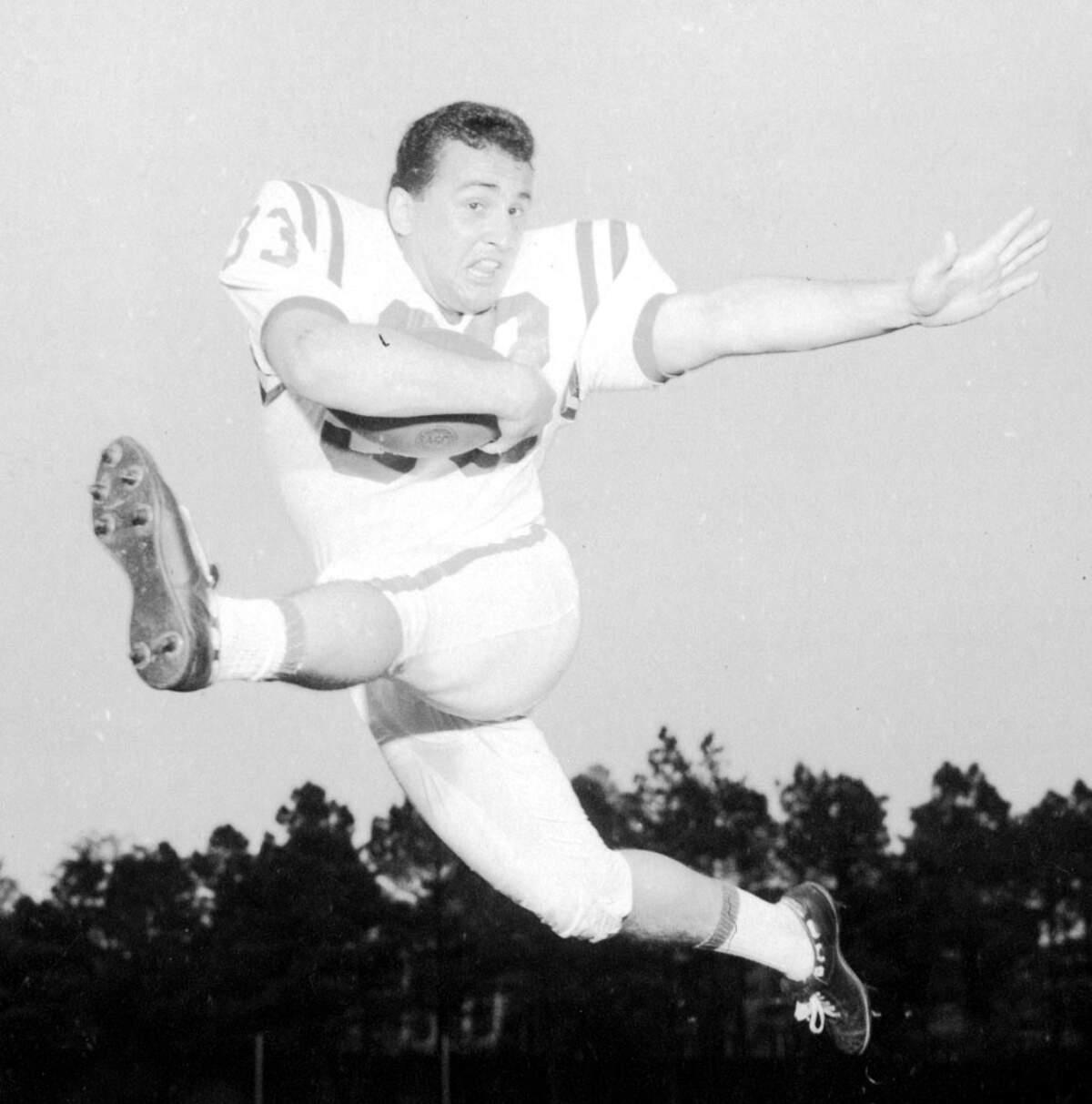 Former NC State football coach Chuck Amato has died. See photos from his career