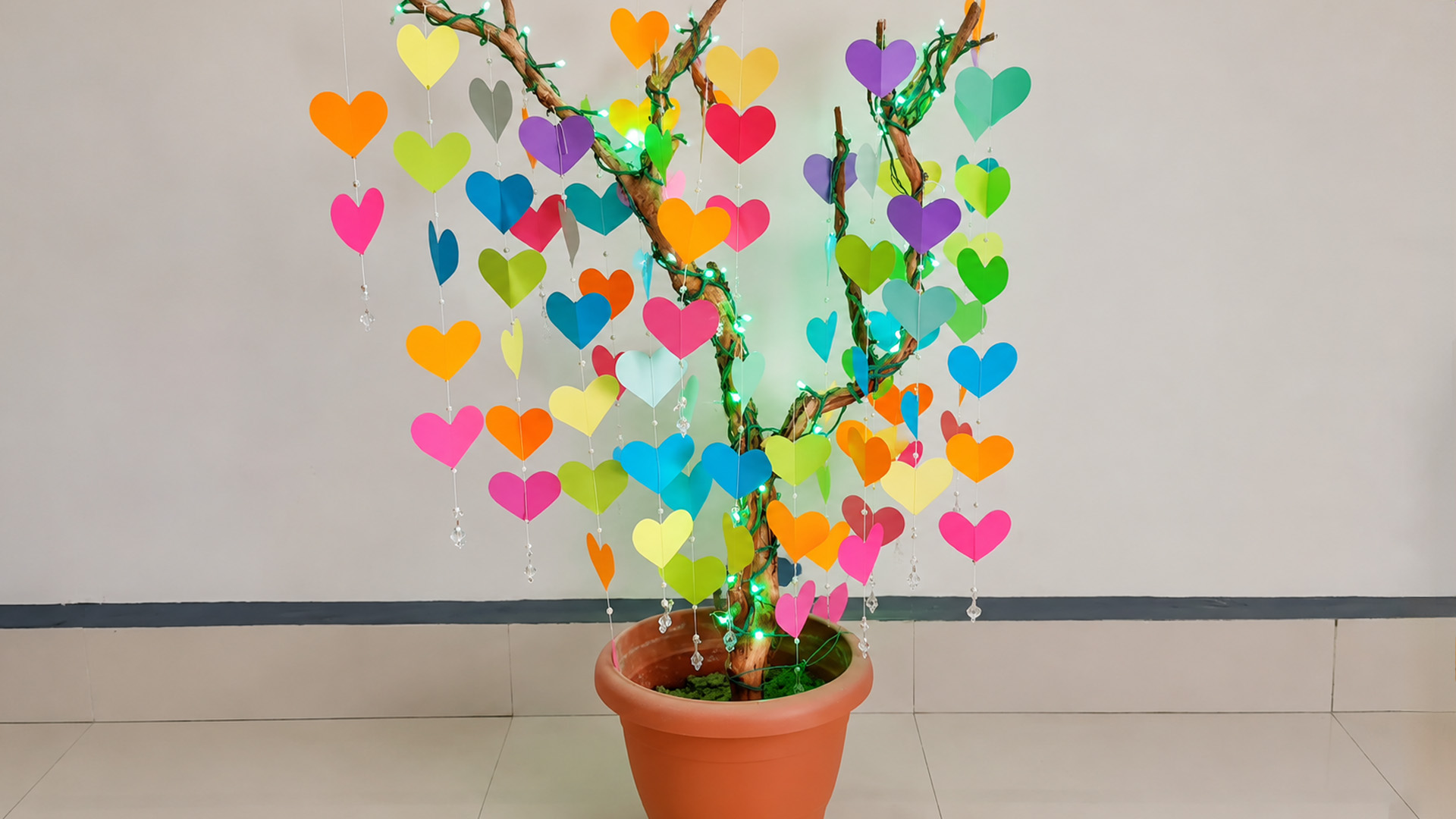 DIY Christmas tree decoration using dry branches and paper hearts