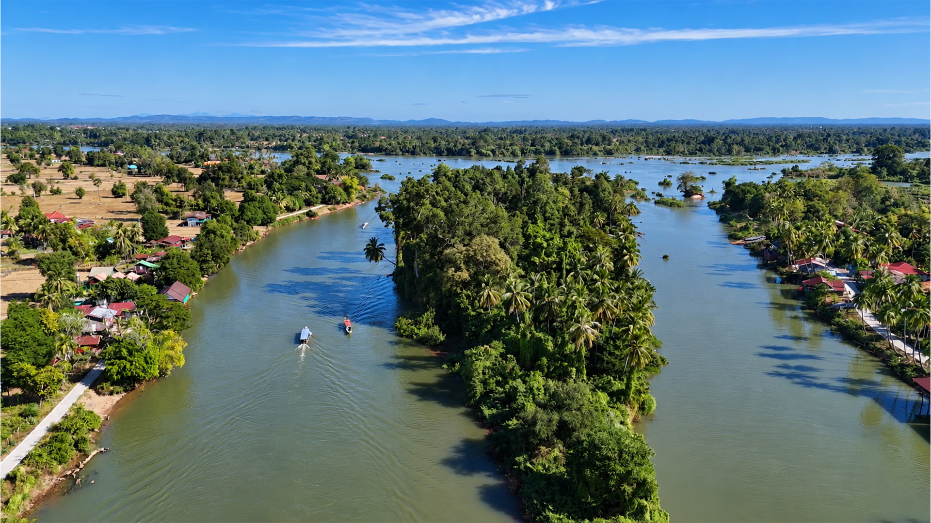 Cruising past villages on Laos’s Mekong Islands