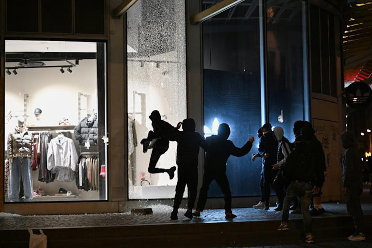 French police launch curfews in Paris and other cities to quell riots