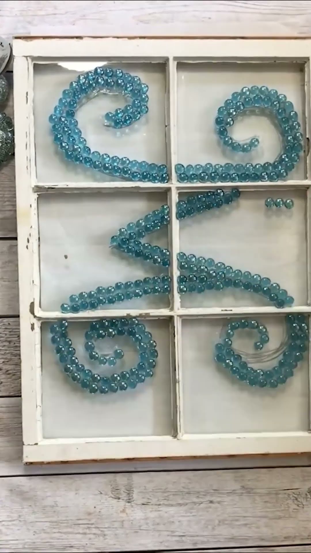 Grab some Dollar Tree gems & an old window...