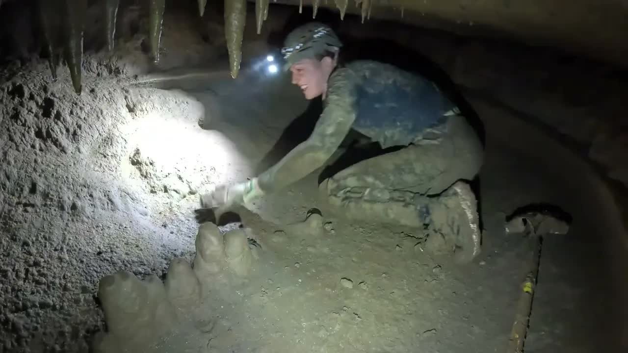 A trash-filled hole in the forest led explorers into a cave with ...