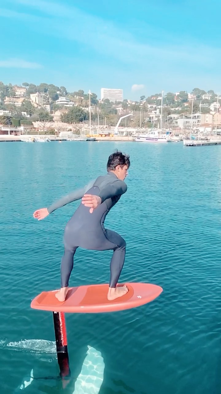 Wing foiling across waves and open water