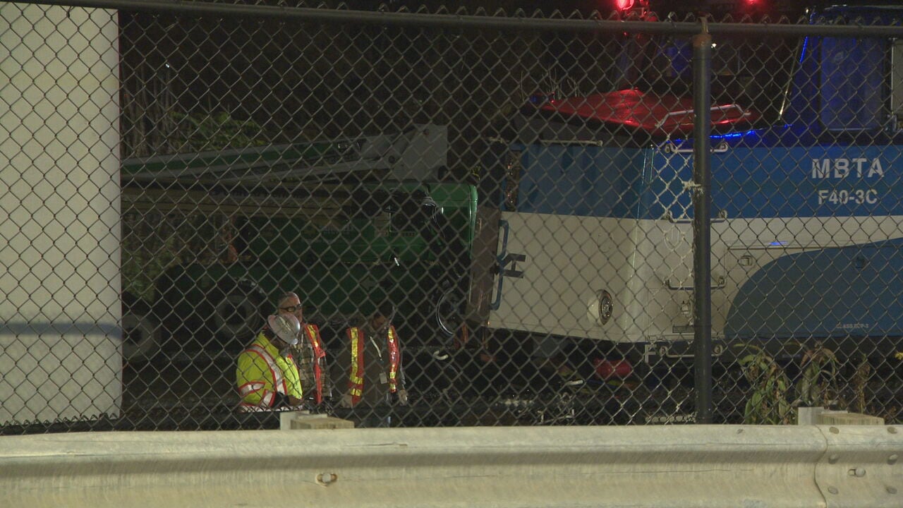MBTA commuter rail train clips boom lift