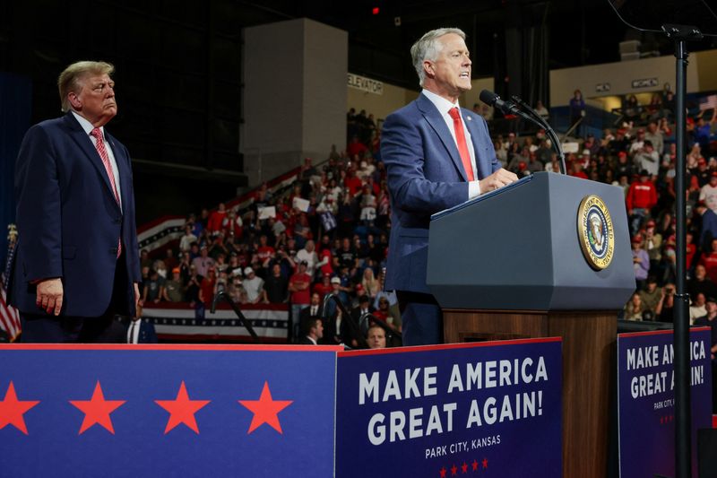 US President Donald Trump looks on as Republican US Senate reelection candidate Roger Marshall (R-KS) speaks during a rally in Park City, Kansas, US, October 19, 2026. REUTERS/Jonathan Ernst