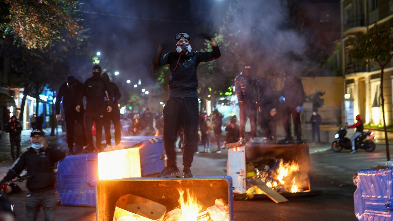 Albanians set fire to government buildings and clash with riot police ...