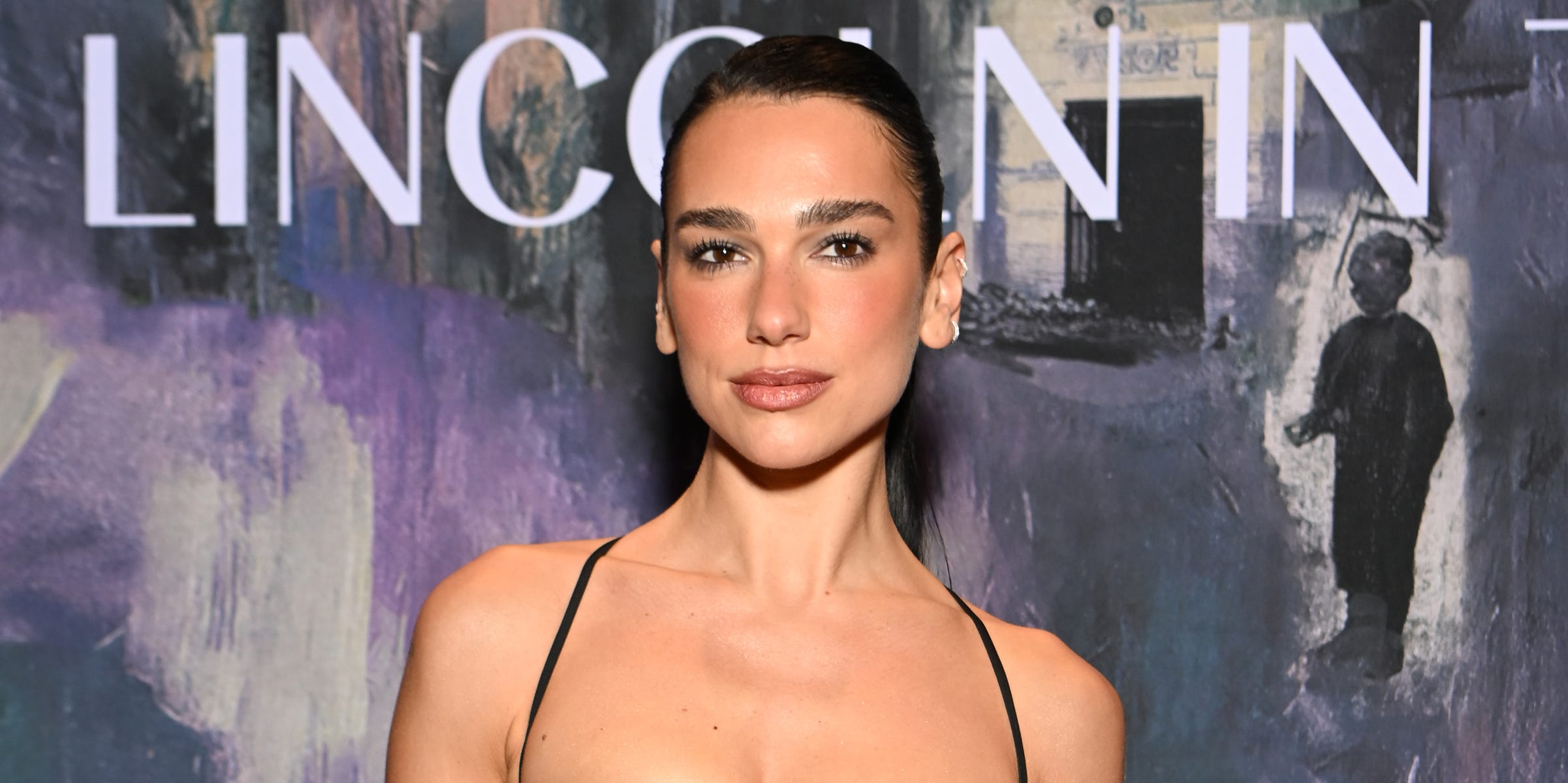 Dua Lipa’s opera gloves shimmer with cascades of sequins