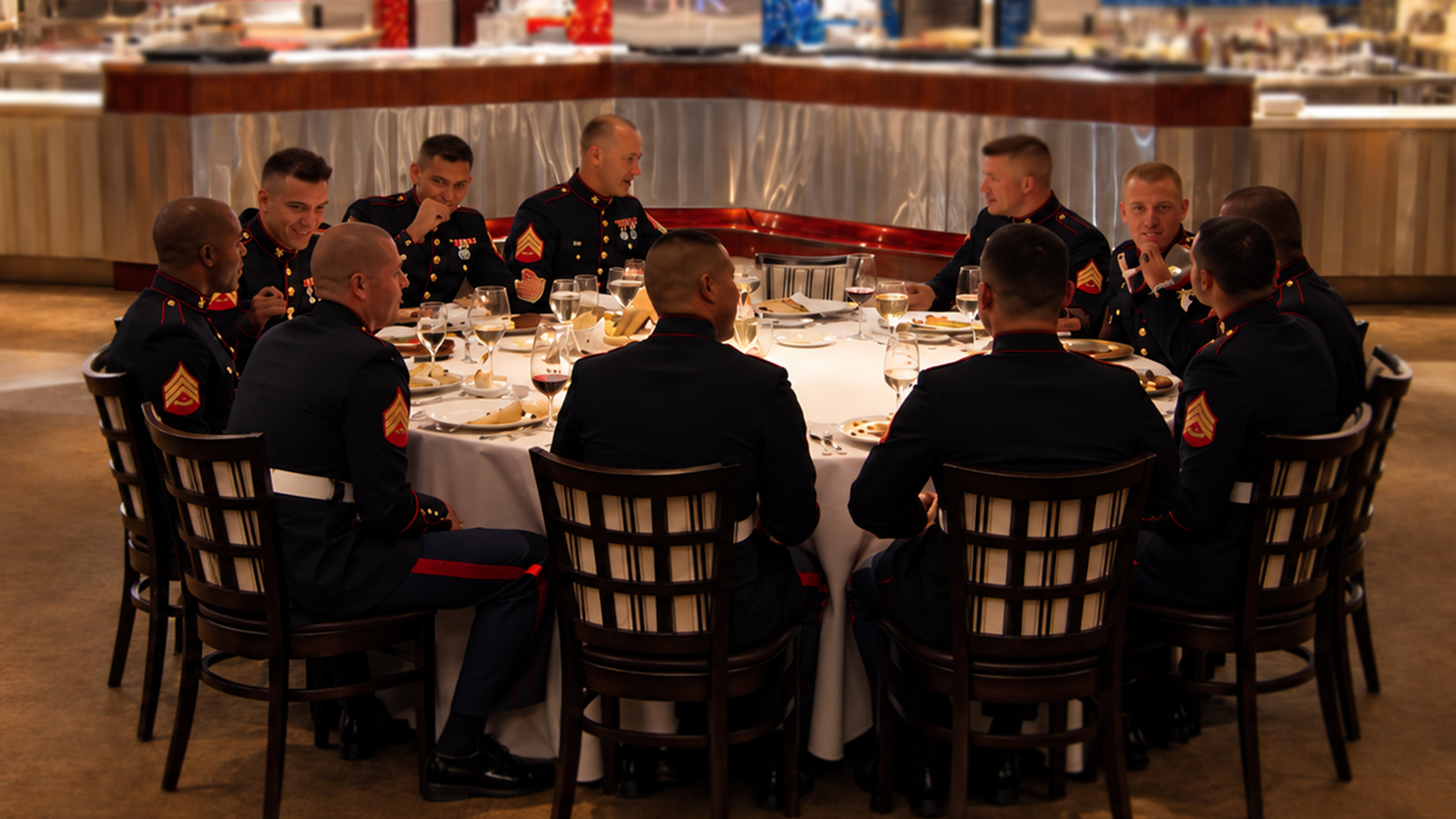 Marines wait for dinner as Chef Ramsay clears the blue kitchen
