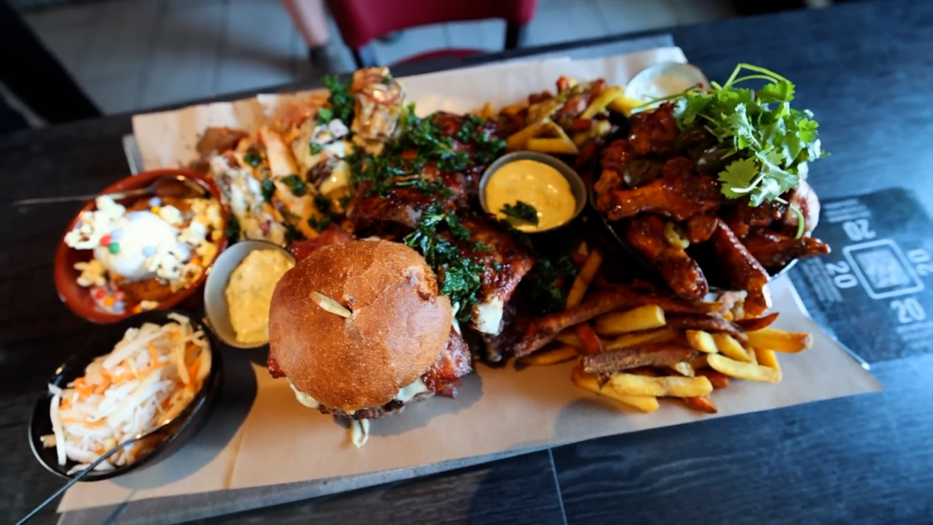 Woman attempts giant Finnish food challenge loaded with burgers, ribs ...