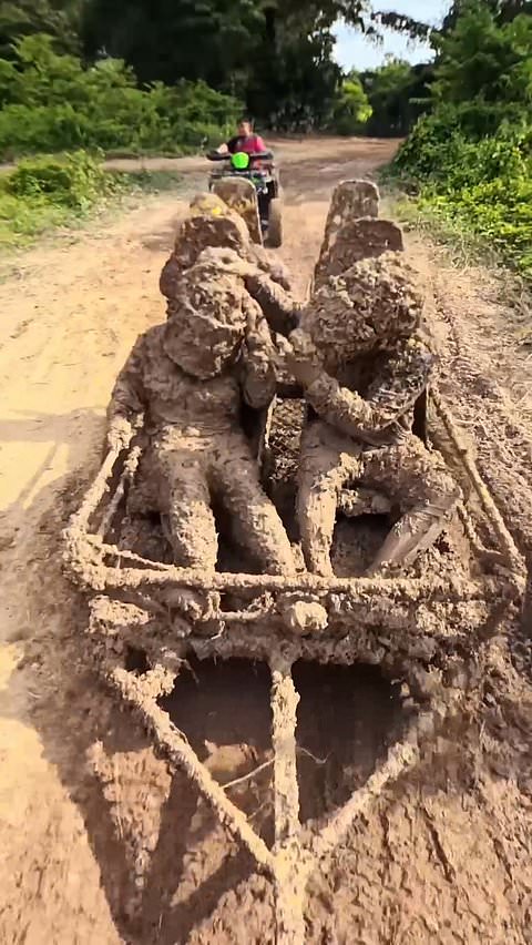 Tourists get covered in mud during ATV ride in Thailand