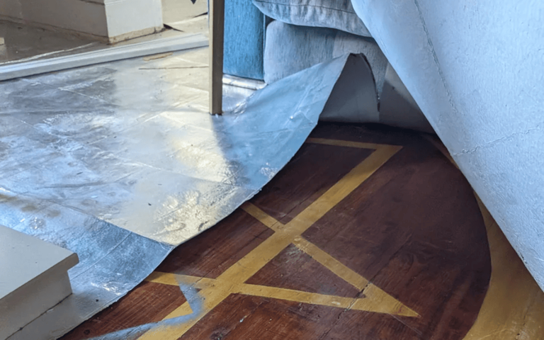 Woman renovating living room discovers 'spooky' symbol under flooring
