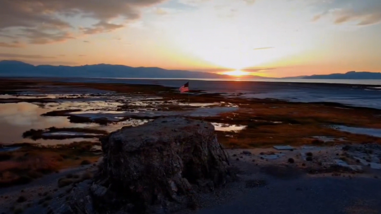 Drone footage showcases American flag on Black Rock by Great Salt Lake