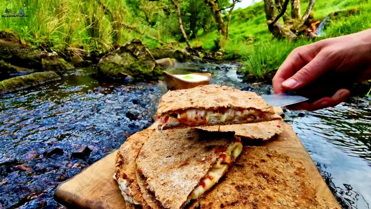 Crispy homemade quesadillas cooked over an open fire