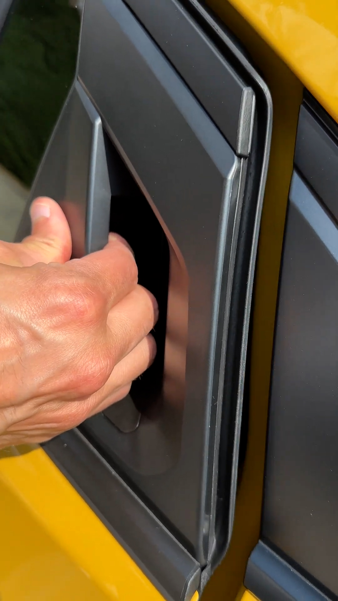 Toyota Prius features a hidden door release button