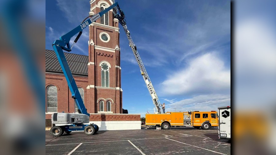 Firefighters rescue painter stranded atop church tower