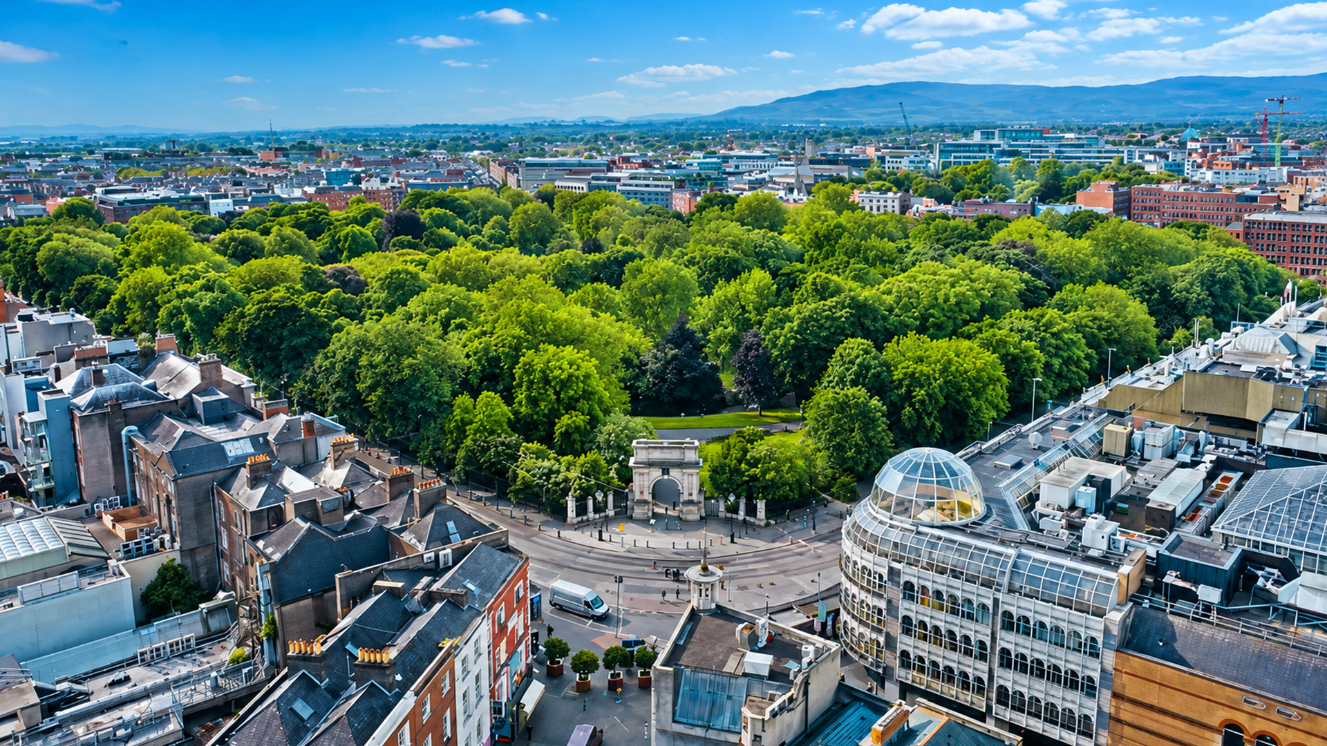 A historic Dublin park stands among busy city streets
