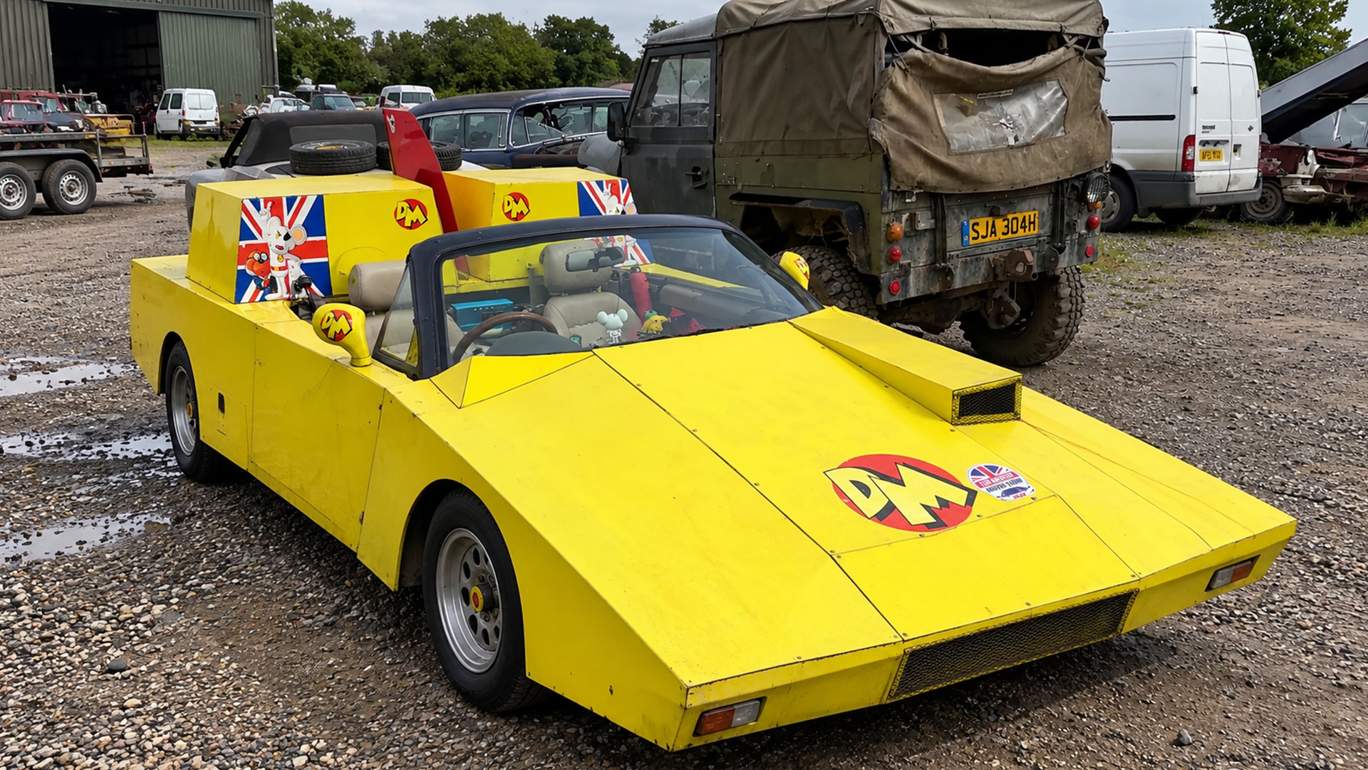 This unusual yellow car is actually a modified Mazda