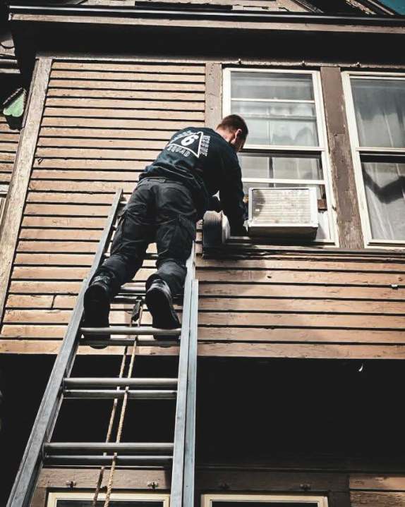 Photos: KDPS officer rescues dog stuck in window