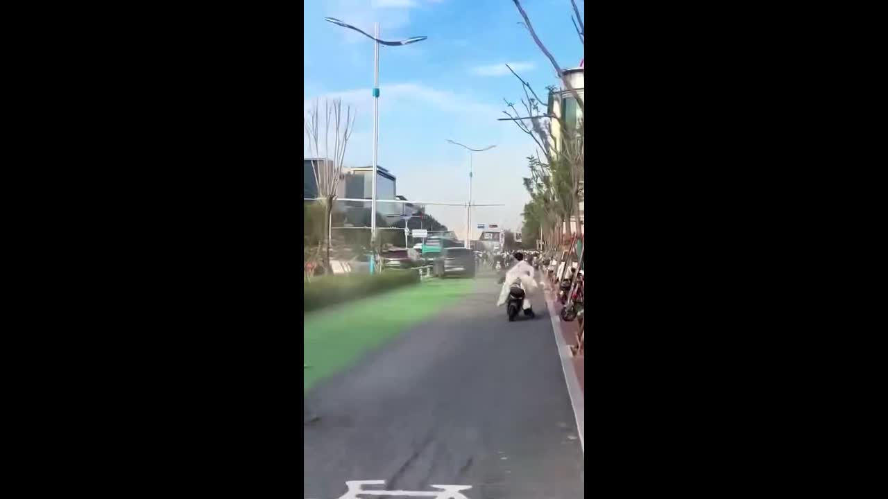 Electric car ploughs into cyclists and scooter riders on busy road in China
