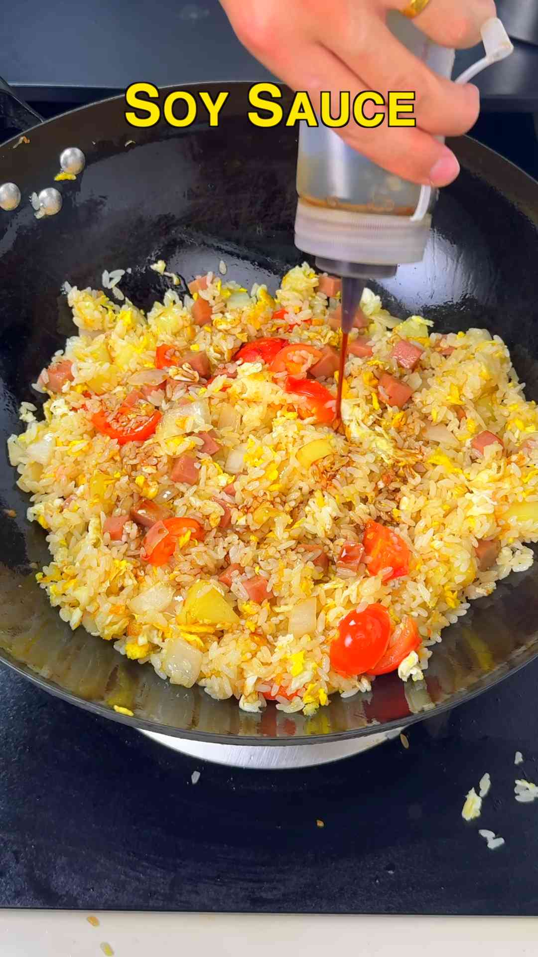 Tomato and potato egg fried rice with luncheon meat
