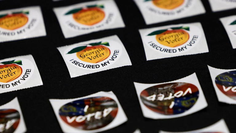 I Voted stickers are ready for voters on the first day of early voting in Atlanta on October 13. - Jonathan Ernst/Reuters