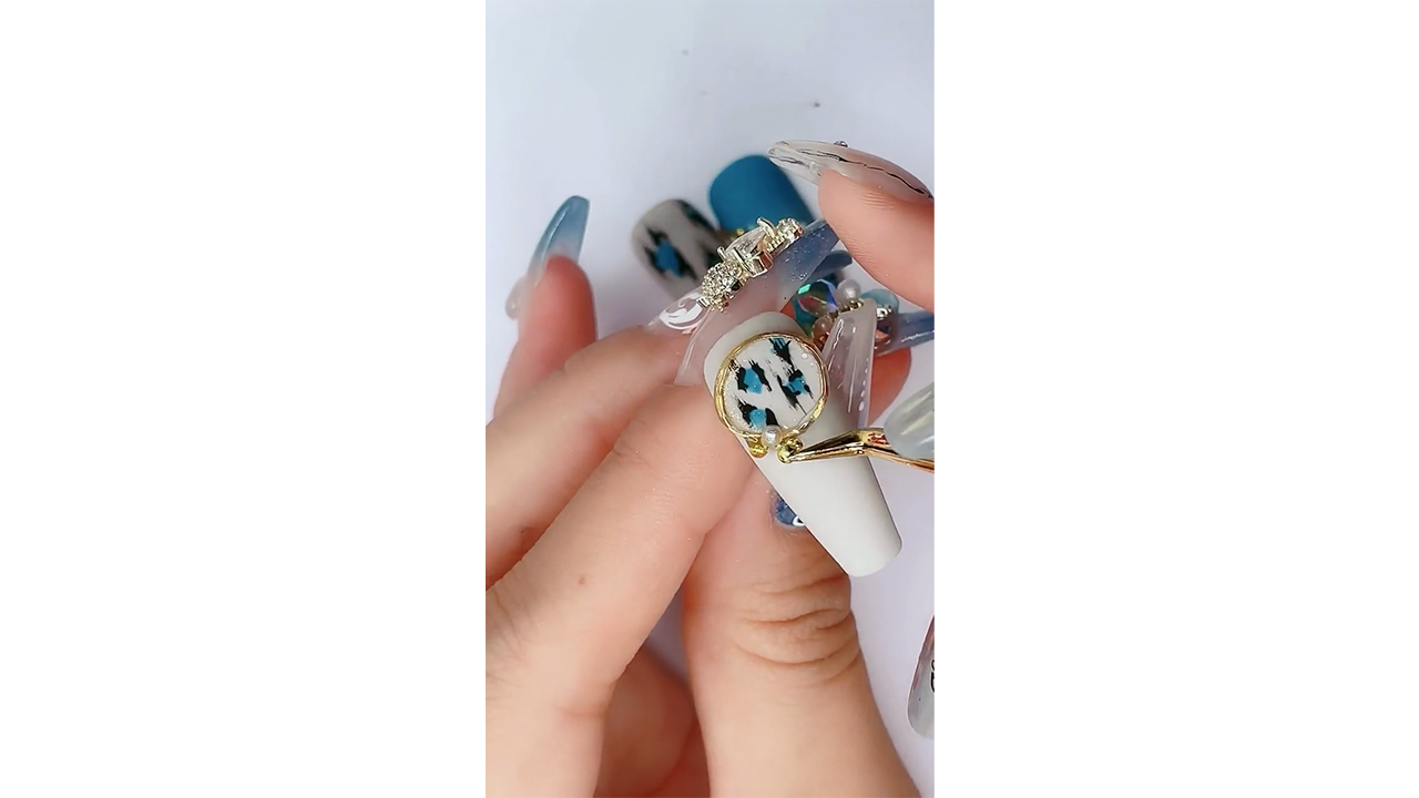 Creating elegant white nails with blue marble art and gold frame accent