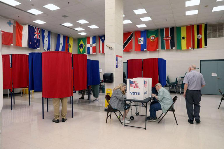 FILE PHOTO: Nashua residents fill out their baloots at a polling station during the New Hampshire State Primary Election in Nashua, New Hampshire, U.S., September 8, 2026. REUTERS/Kacey Chapman/File Photo