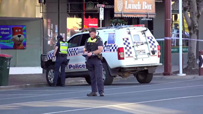 Members of the police stand guard at the crime scene of a vehicle attack on Australian lawmaker Helen Haines in Wangaratta, on October 19, 2026. - ABC/Reuters